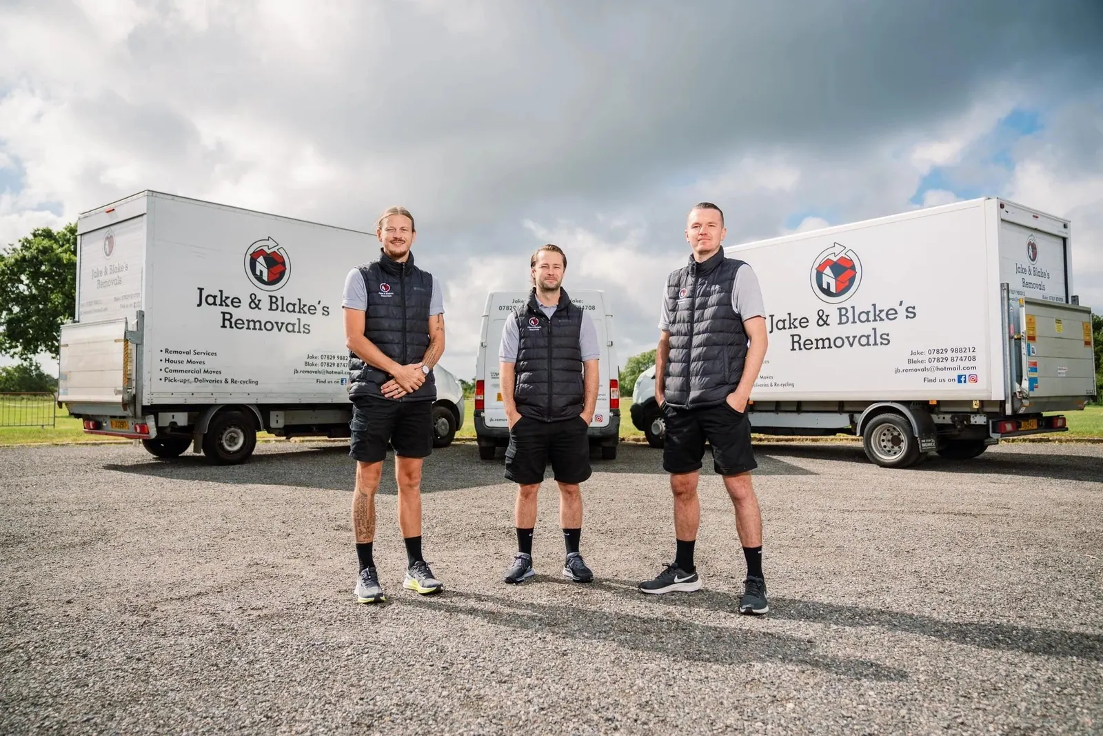 Three removal crew beside their lorries