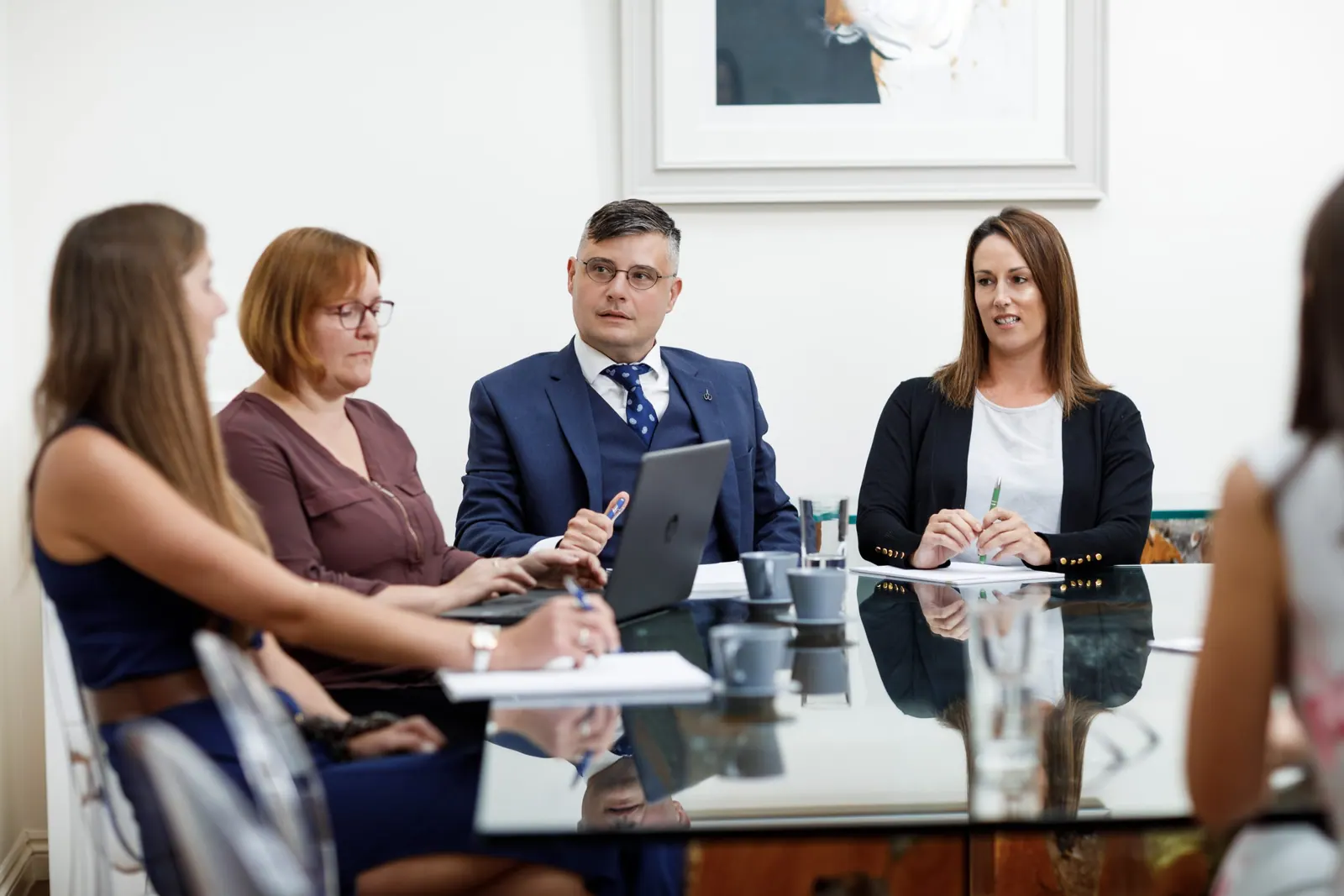Lawyers meeting around a glass table