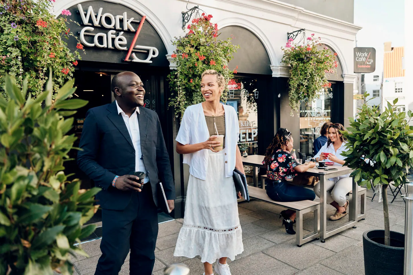 People outside a Santander Work Café